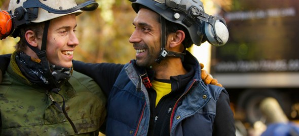 Two Tree Surgeons Laughing and Looking at Each Other